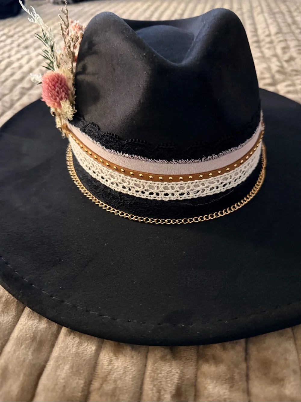Black Wide-Brim Fedora with Decorative Band and Floral Accent